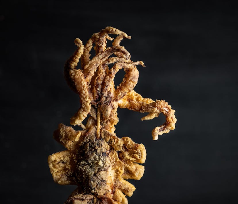 A stick of battered deep-fried squid.