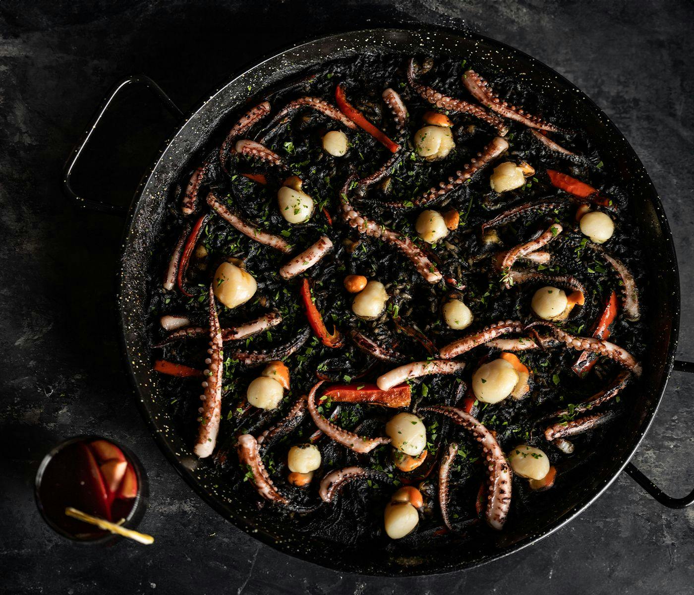 A huge dish of seafood paella.