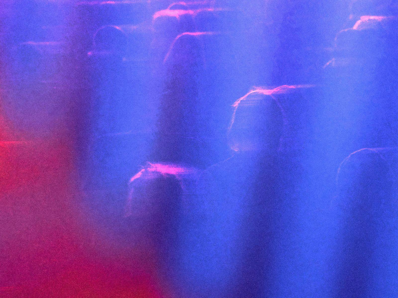 An abstract overlayed image of blurry people, shapes and colours.