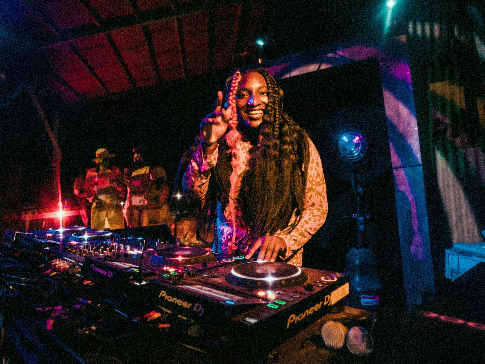 Ayebatonye performs on a large DJ setup.